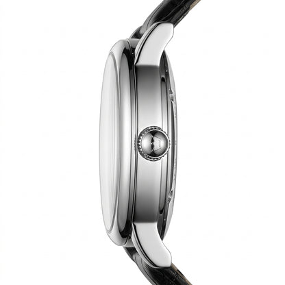 Close-up of a watch with a silver case and black strap on a white background