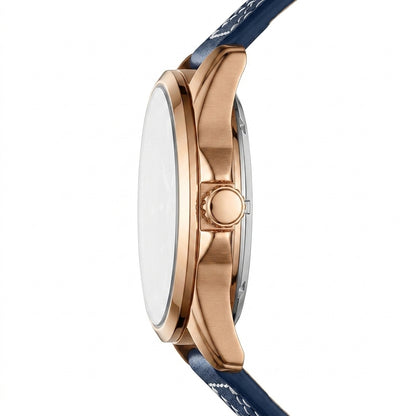 Close-up of a watch with rose gold case and blue strap on a white background