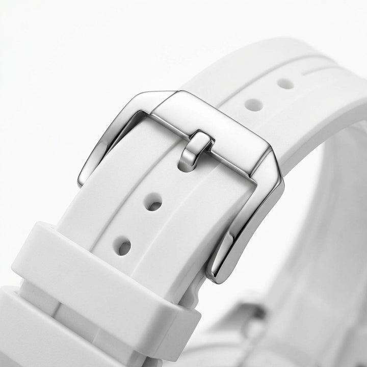 Close-up of a white watch strap with a silver buckle on a light gray background