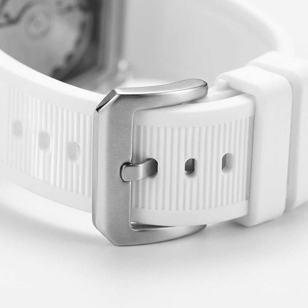 Close-up of a white watch strap with silver buckle on a light gray background