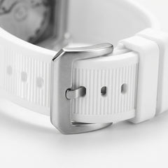 Close-up of a white watch strap with silver buckle on a light gray background