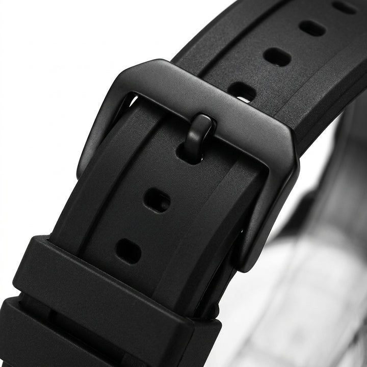 Close-up of a black watch strap with buckle on a white background