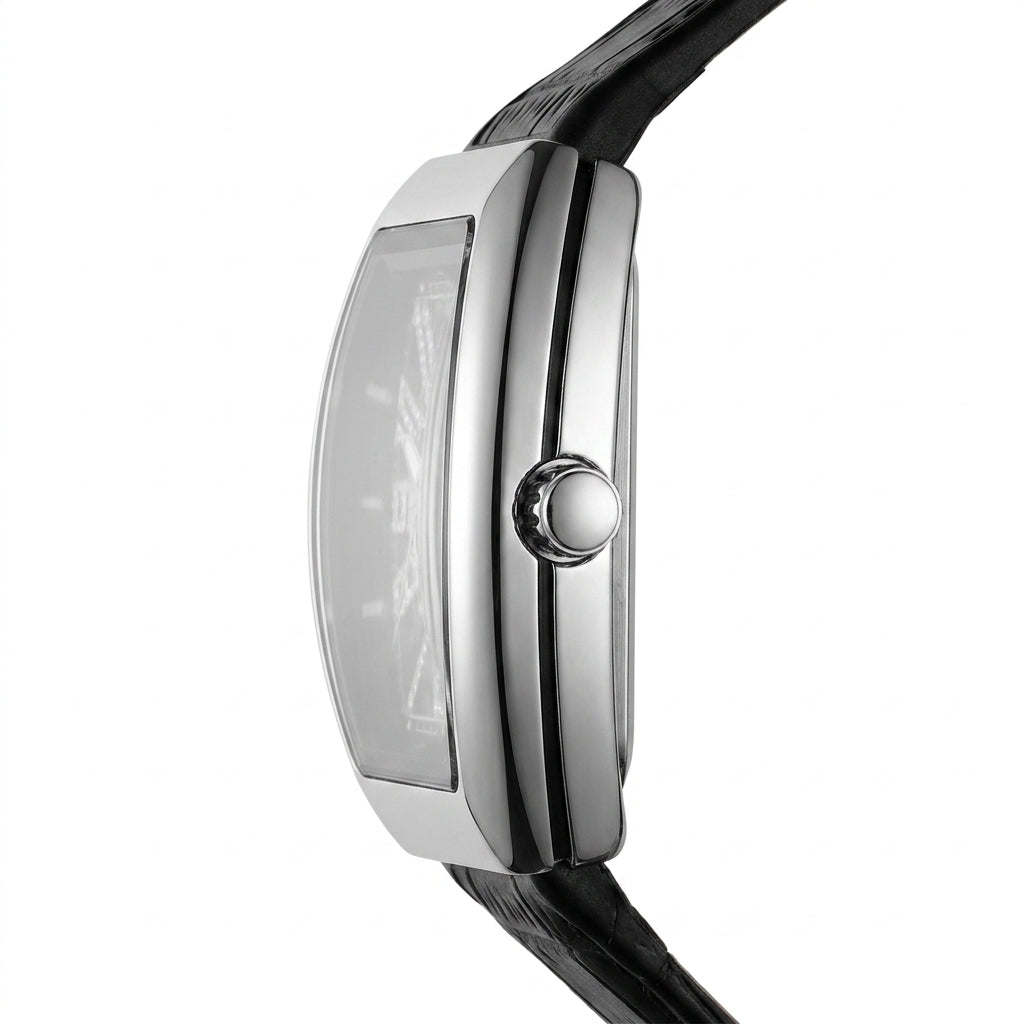Close-up of a silver watch with a black strap on a white background