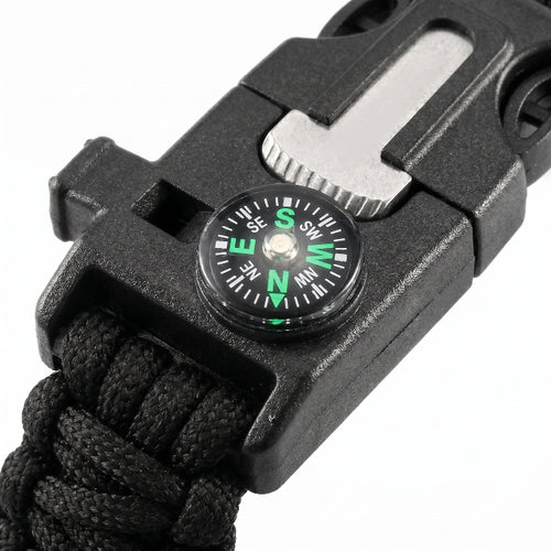 Black multi-tool with compass on a white background