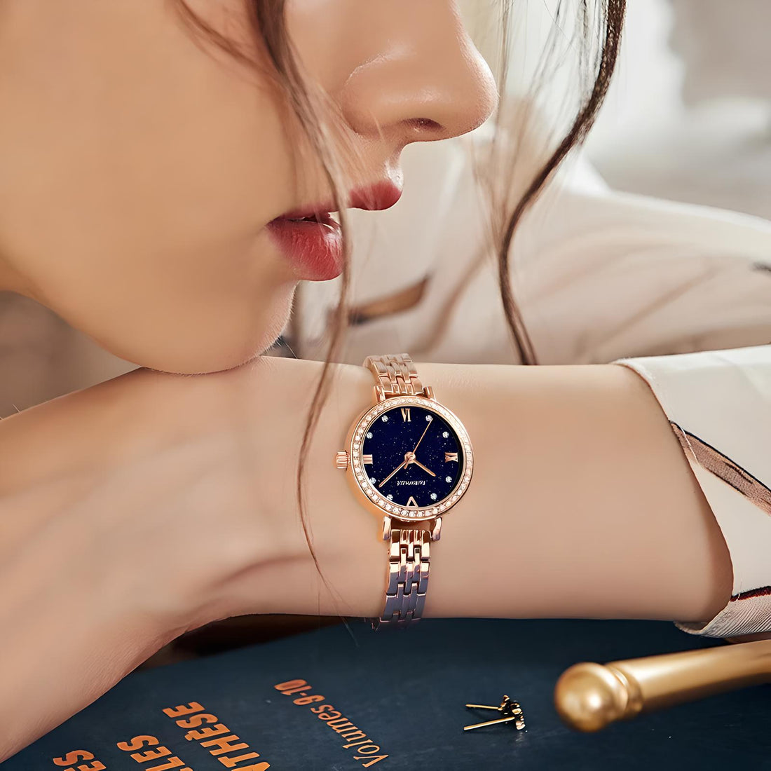 Elegant woman wearing Mark Fairwhale LUMORA 3250 starry sky watch with rose gold bracelet – lifestyle wrist shot