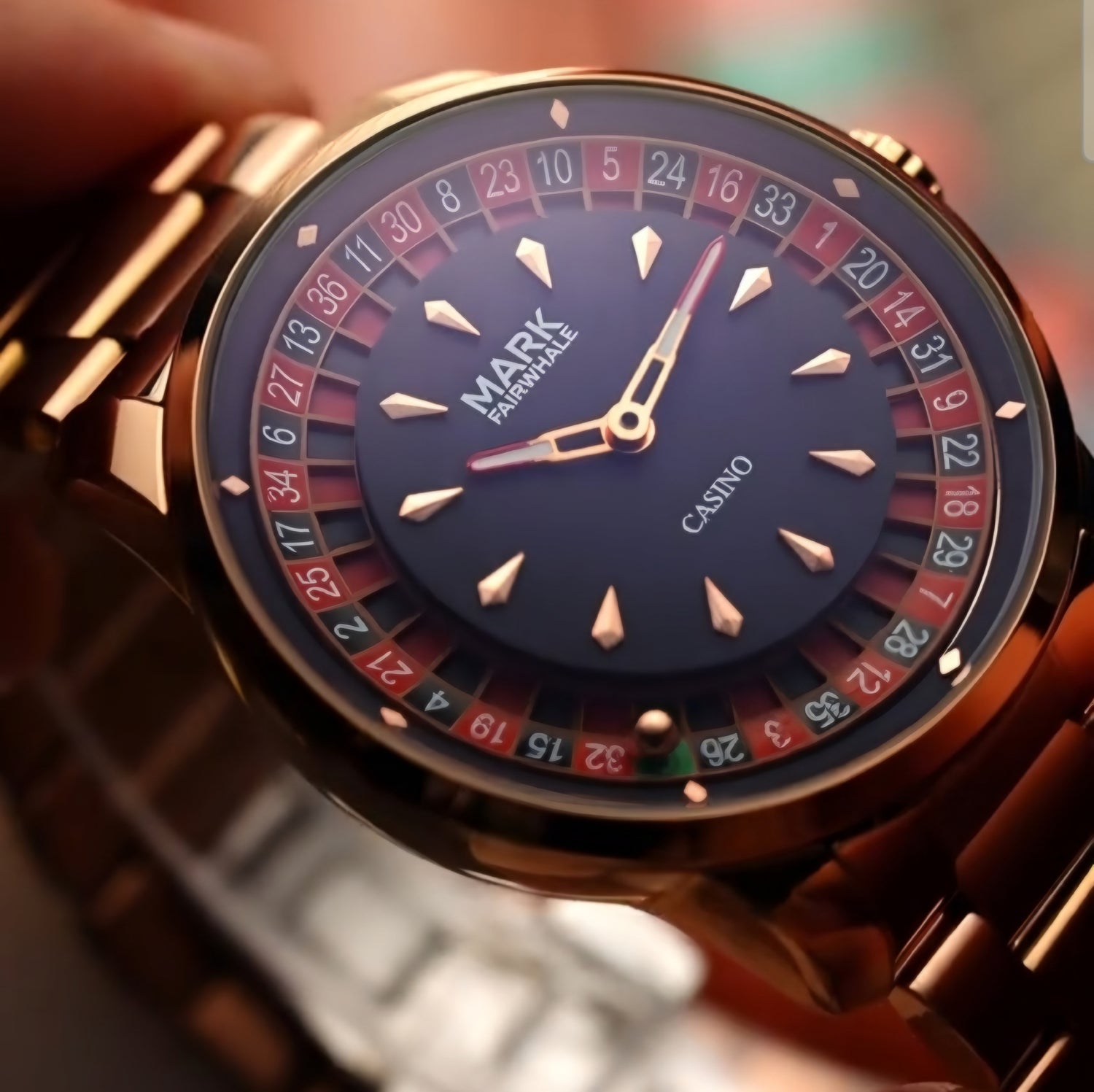 Close-up of the Mark Fairwhale 5031 CASINO men’s watch in rose gold, featuring roulette-style dial and elegant bracelet.