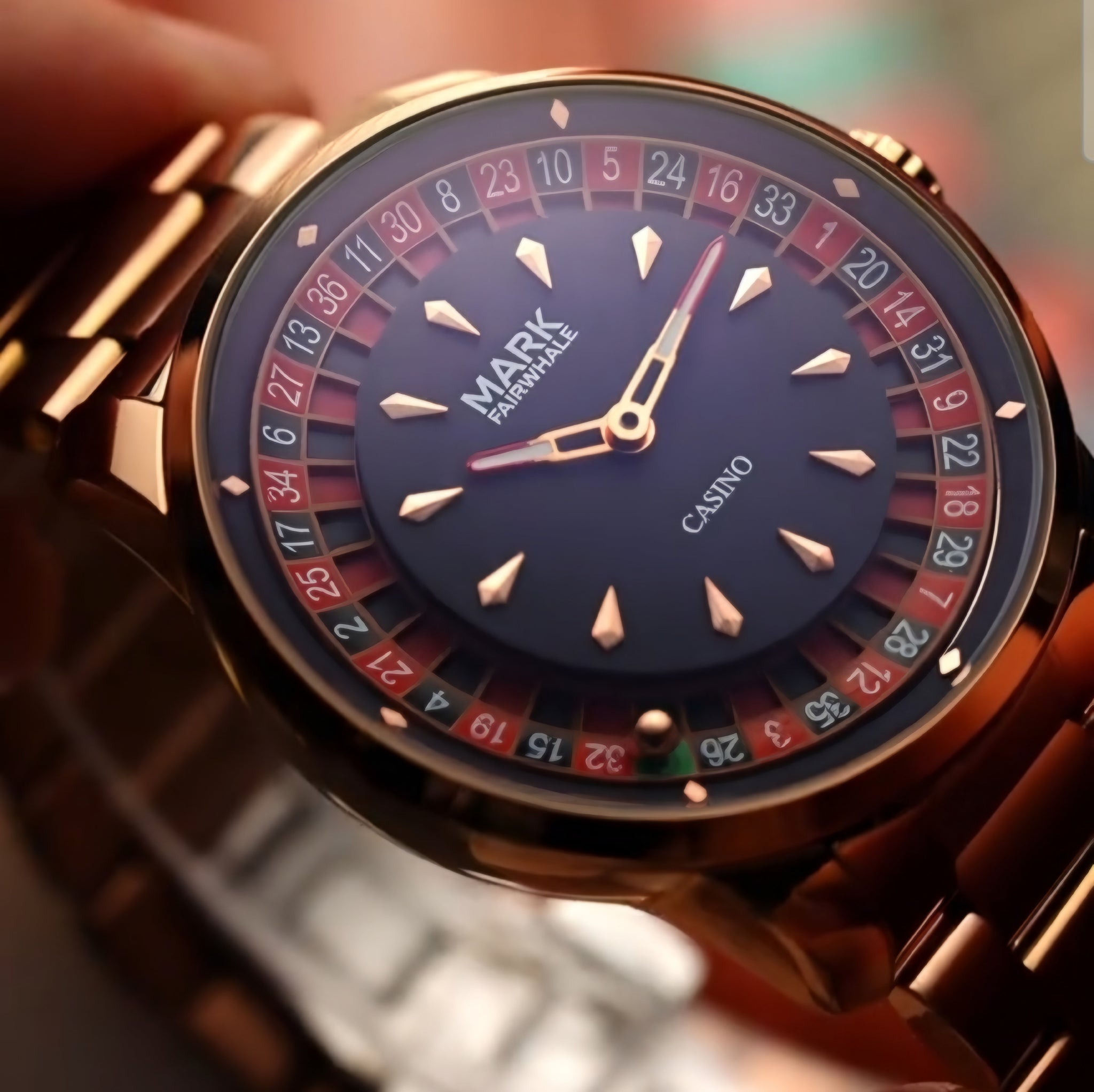 Close-up of the Mark Fairwhale 5031 CASINO men’s watch in rose gold, featuring roulette-style dial and elegant bracelet.