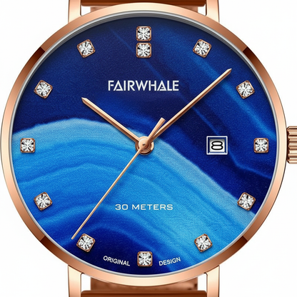 Fairwhale watch with blue face and rose gold casing on a white background