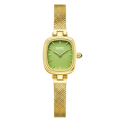 Gold watch with a green face on a white background