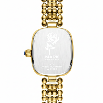 Gold watch with a clear face on a white background