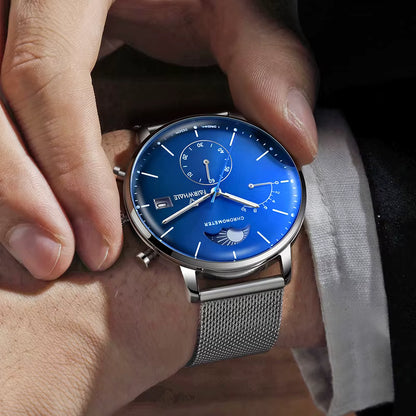 Man wearing MARK FAIRWHALE ASTRON quartz moon phase chronograph blue dial mesh watch”