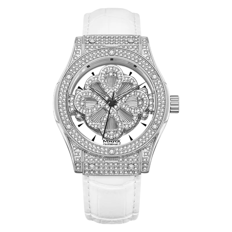Luxury watch with diamond-studded face and white strap on a white background