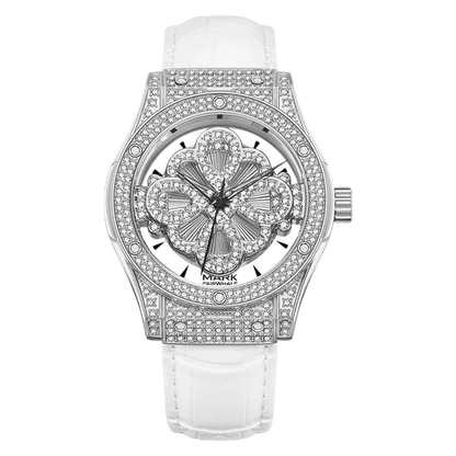 Luxury watch with diamond-studded face and white strap on a white background