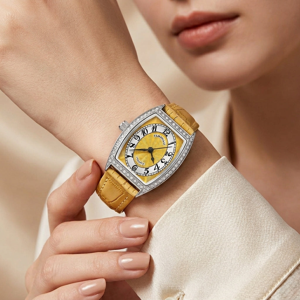Luxury watch with a yellow strap worn by a person, close-up on wrist.