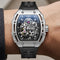 Luxury watch with black strap and silver case on a wrist