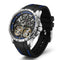 Luxury watch with black strap and visible mechanical components on a white background