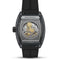 Luxury watch with intricate design and black strap on a white background