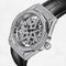 Luxury watch with intricate design and diamond accents on a white background