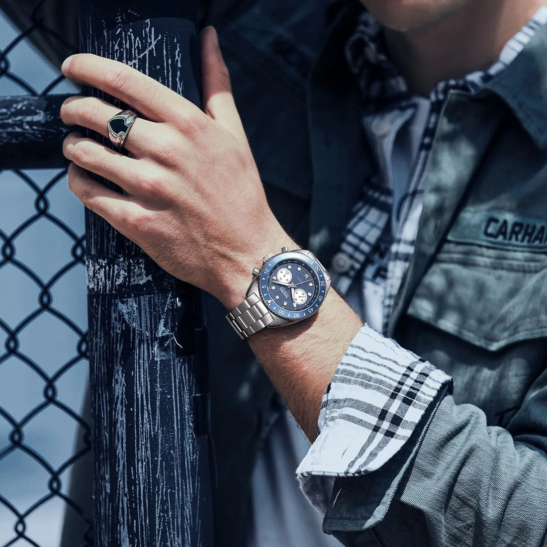 MARK Fairwhale 5910 TARNIX silver and blue chronograph watch with tachymeter bezel on wet surface