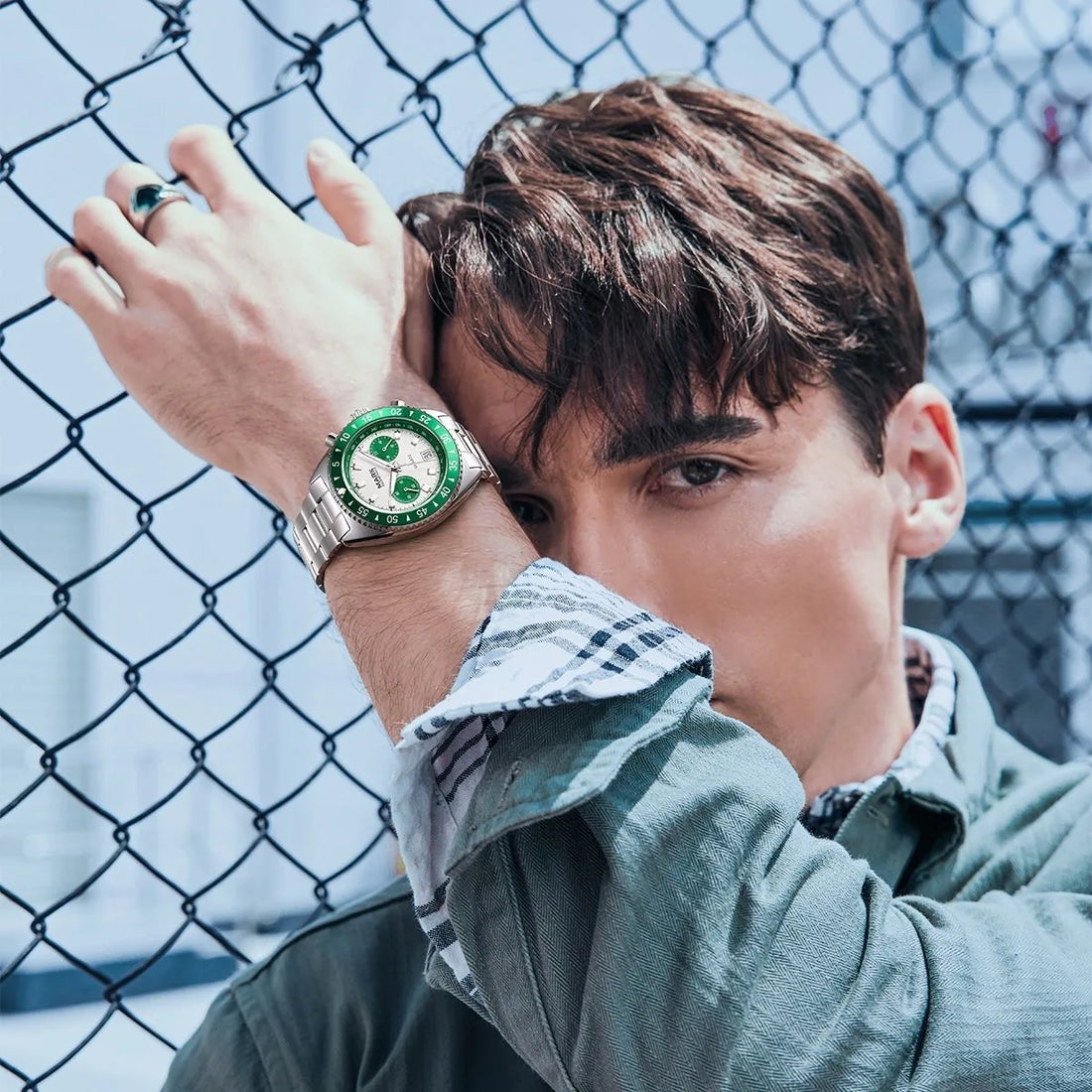 MARK Fairwhale 5910 TARNIX silver and green chronograph watch with tachymeter bezel on wet surface
