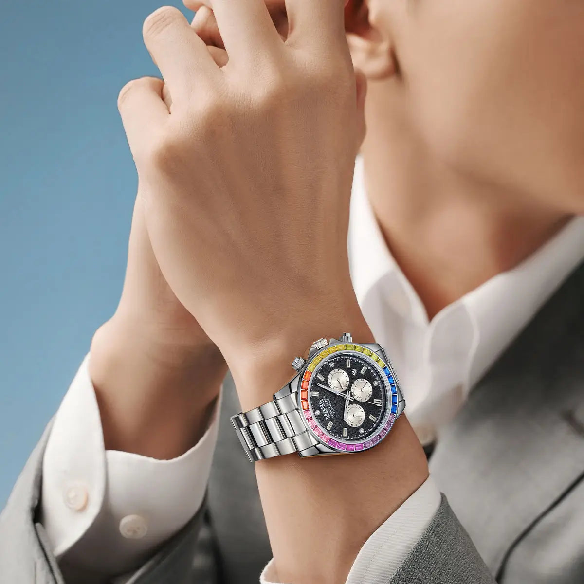 Man wearing silver Mark Fairwhale 6009 RAINORA rainbow automatic watch with suit