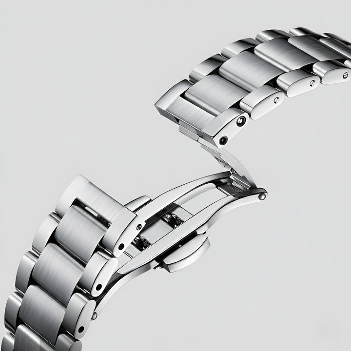 Mark Fairwhale FW 6027 skeleton automatic watch - Close-up of a silver watch band on a light gray background