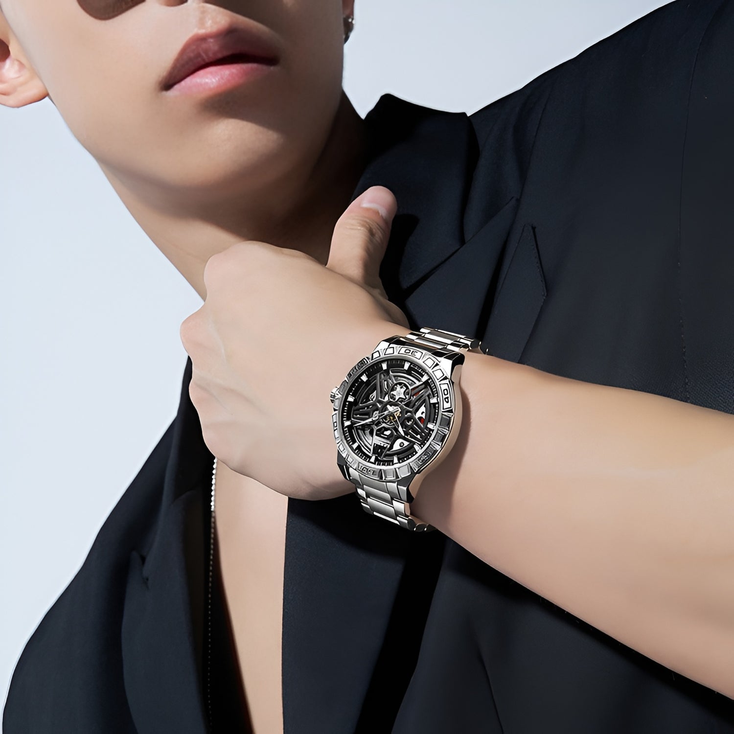 Skeleton automatic watch Mark Fairwhale FW 6027 worn on wrist showing modern steel bracelet and openworked dial