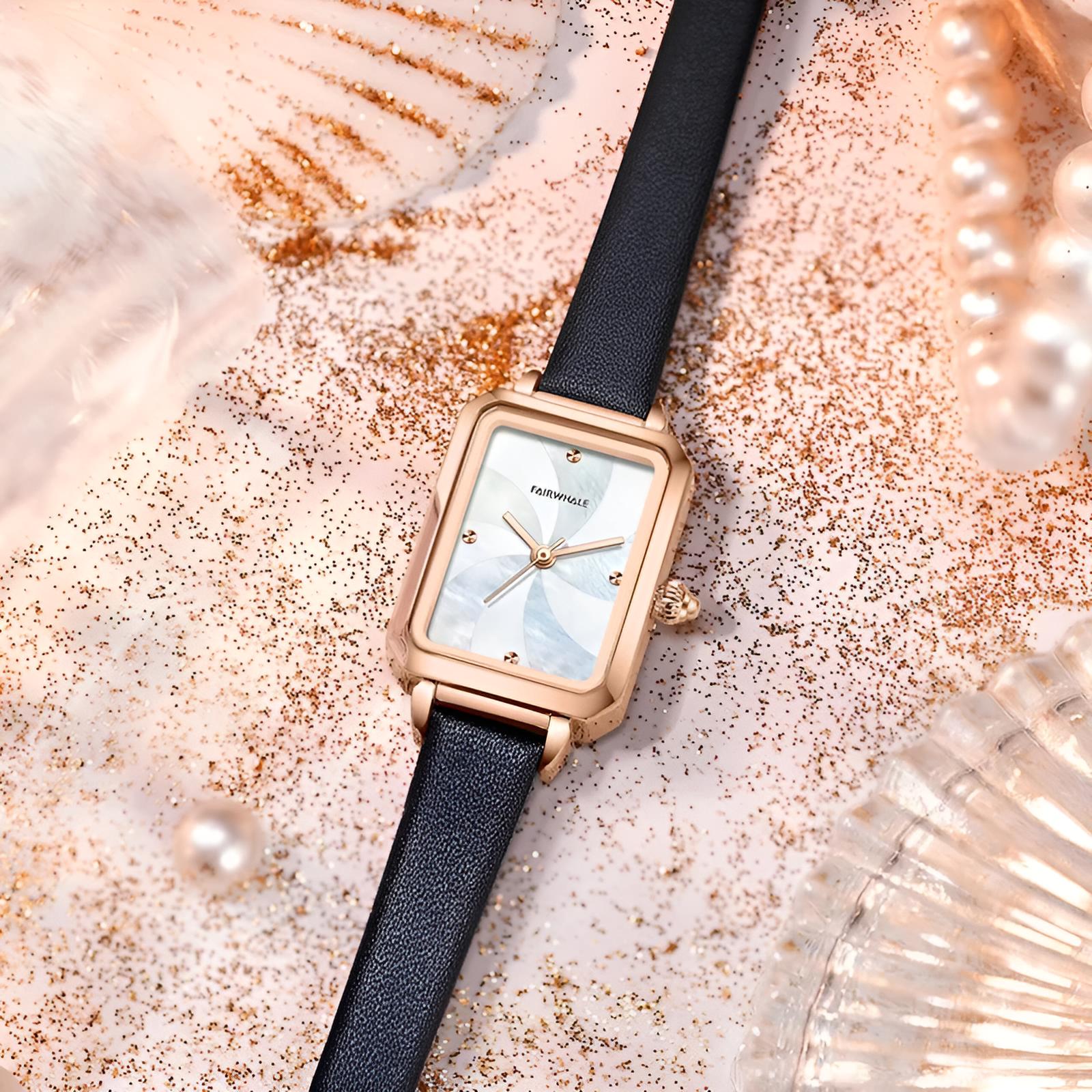 Mark Fairwhale 3290 NOVEA women’s vintage square watch with rose gold case and black leather strap, styled among pearls and golden glitter