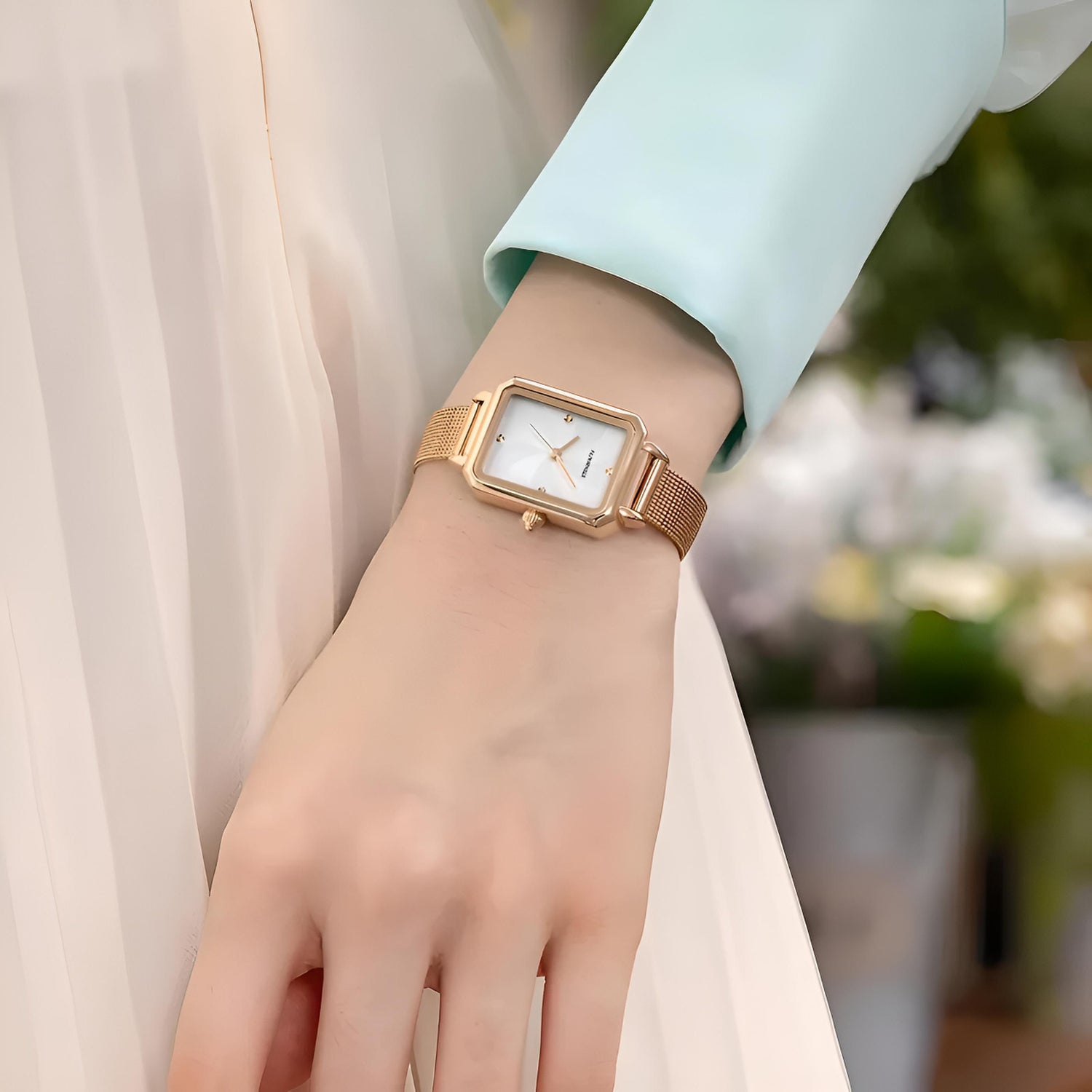 Mark Fairwhale 3290 NOVEA women’s vintage square watch with rose gold case and rose gold leather strap, styled among pearls and golden glitter