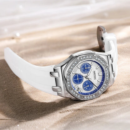 Mark Fairwhale 3590 VIVENA women’s retro watch with white silicone strap and blue chronograph dial on sand, showcasing elegant design and sparkling bezel
