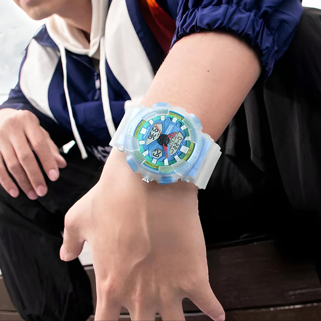 Mark Fairwhale 4370 VYBRO analog-digital watch with bright blue LED illumination showing dual time, calendar, and chronograph display in the dark.