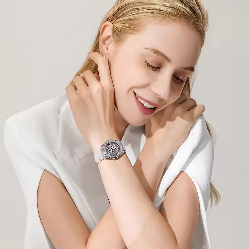 Mark Fairwhale 4465 LUXORA women’s iced-out watch with rotating star-shaped dial, stainless steel case, and crystal-encrusted bezel