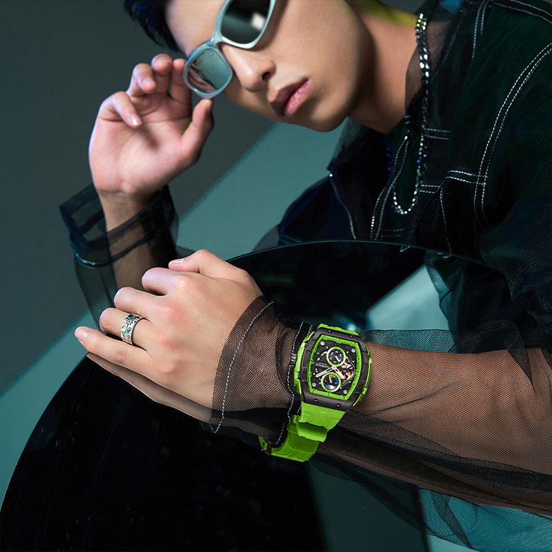 Model wearing the Mark Fairwhale AETERNUS green edition, styled with futuristic fashion and bold accessories.
