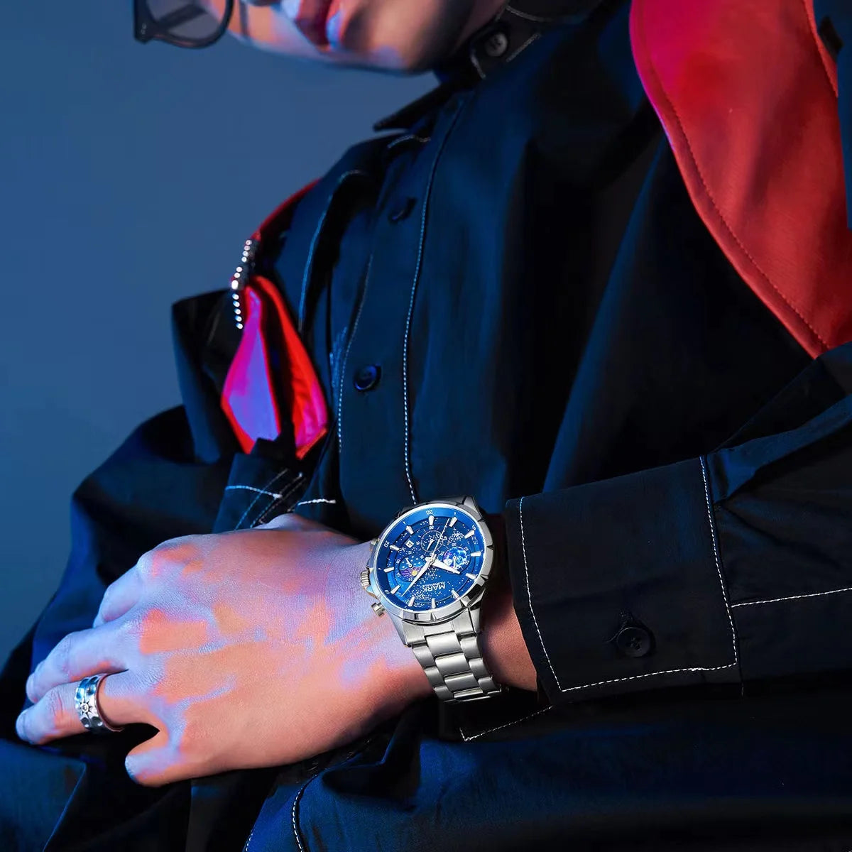 Stylish man wearing Mark Fairwhale ASTRIX starry sky quartz watch with stainless steel strap – elegant men’s wristwatch.