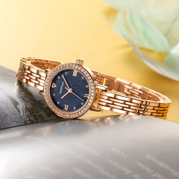 Mark Fairwhale LUMORA 3250 luxury women’s quartz watch with starry dial displayed on book – elegant flat lay
