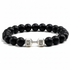 Black beaded bracelet with silver dumbbell-shaped charms on a white background