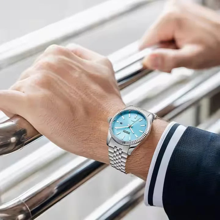Mark Fairwhale VELUXOR men’s watch with blue dial styled on wrist with business suit