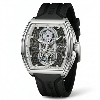 Mark Fairwhale men’s automatic skeleton watch with silver tonneau case, open heart dial and black rubber strap, shown in partial three quarter product view on light gray background
