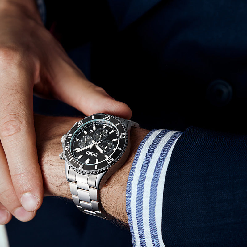 Mark Fairwhale men’s luxury chronograph watch with emerald green dial and stainless steel bracelet, bold design for modern style.