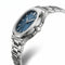 Mark Fairwhale silver watch with blue textured dial in three quarter angled view