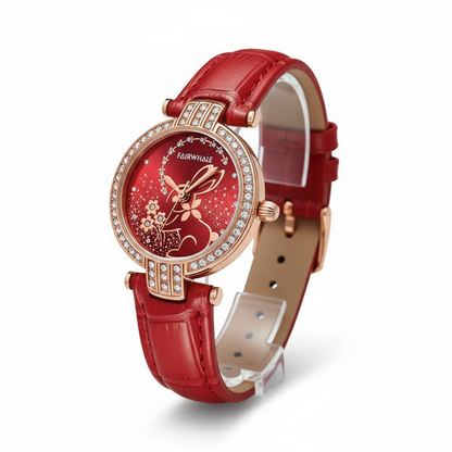 Red watch with a floral design on the dial against a white background