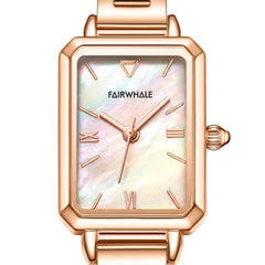 Rose gold watch with a white face on a white background