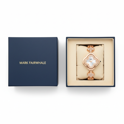 Rose gold bracelet with clover design in a Mark Fairwhale box on a white background