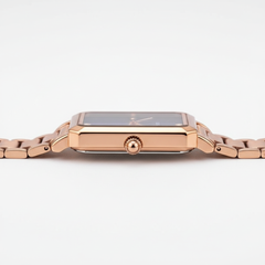 Rose gold watch on a white background