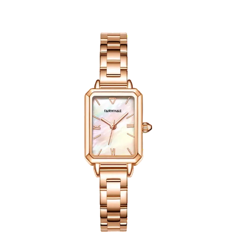 Rose gold watch with a white face on a white background