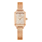 Rose gold watch with a black background