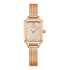 Rose gold watch with a black background
