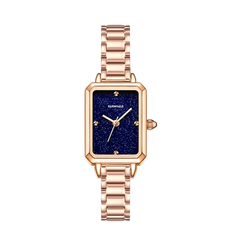 Rose gold watch with a blue face on a white background