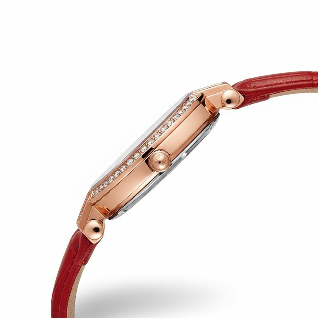 Rose gold watch with a red leather strap on a white background