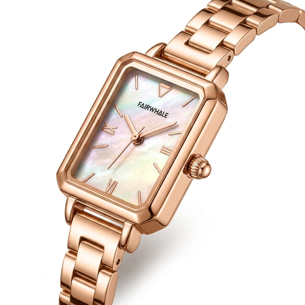 Rose gold watch with a white face on a white background